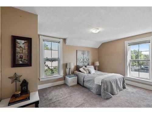 9 Elma Street East, Okotoks, AB - Indoor Photo Showing Bedroom