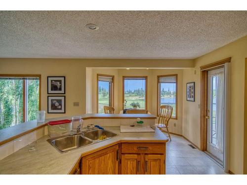 214 Lakeside Greens Place, Chestermere, AB - Indoor Photo Showing Kitchen With Double Sink