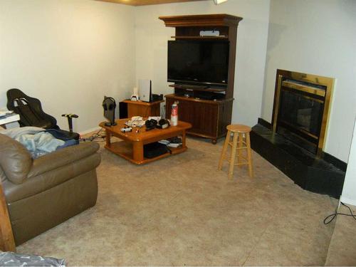 133 6 Avenue Se, Three Hills, AB - Indoor Photo Showing Living Room With Fireplace