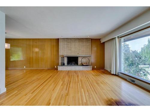 4312 Britannia Drive Sw, Calgary, AB - Indoor Photo Showing Living Room With Fireplace