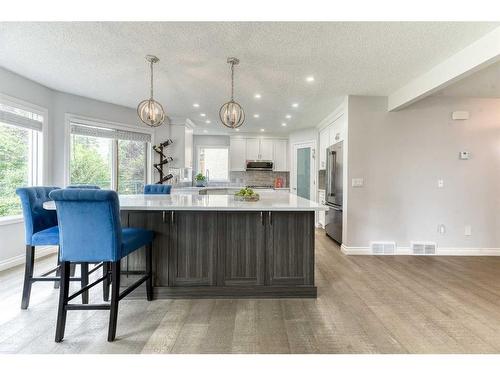 81 Gleneagles Close, Cochrane, AB - Indoor Photo Showing Kitchen With Upgraded Kitchen