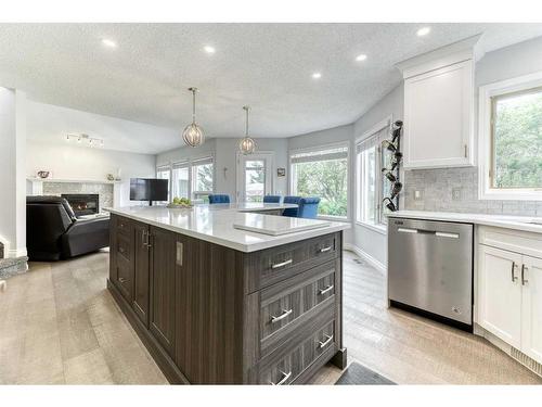 81 Gleneagles Close, Cochrane, AB - Indoor Photo Showing Kitchen With Upgraded Kitchen