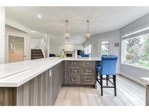 81 Gleneagles Close, Cochrane, AB - Indoor Photo Showing Kitchen With Upgraded Kitchen