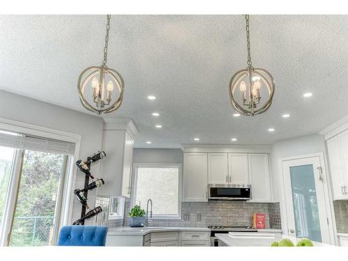 81 Gleneagles Close, Cochrane, AB - Indoor Photo Showing Kitchen