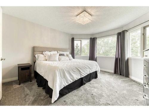 81 Gleneagles Close, Cochrane, AB - Indoor Photo Showing Bedroom