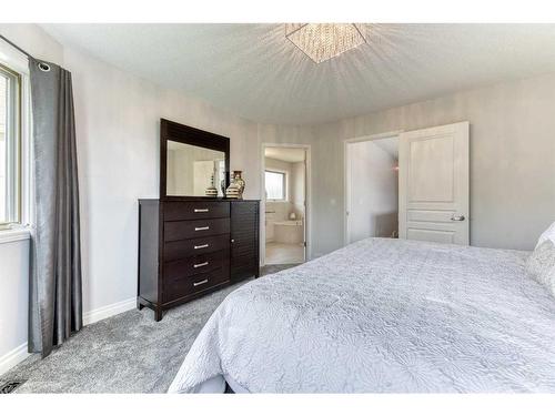 81 Gleneagles Close, Cochrane, AB - Indoor Photo Showing Bedroom