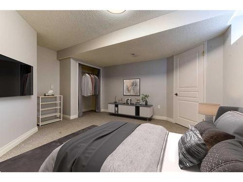 81 Gleneagles Close, Cochrane, AB - Indoor Photo Showing Bedroom