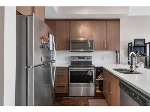 407-605 17 Avenue Nw, Calgary, AB - Indoor Photo Showing Kitchen With Stainless Steel Kitchen With Double Sink