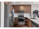 407-605 17 Avenue Nw, Calgary, AB  - Indoor Photo Showing Kitchen With Stainless Steel Kitchen With Double Sink 