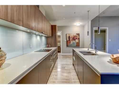 707-1122 3 Street Se, Calgary, AB - Indoor Photo Showing Kitchen With Double Sink With Upgraded Kitchen