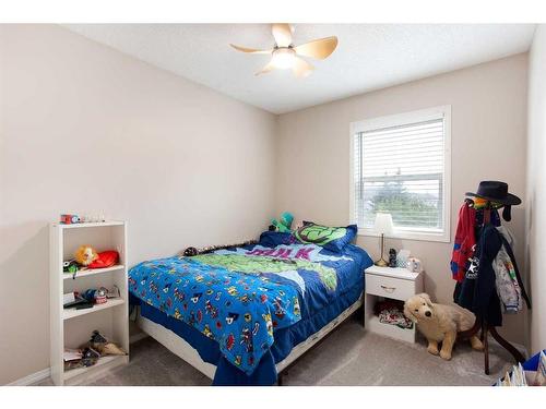 109 Prairie Sound Circle Nw, High River, AB - Indoor Photo Showing Bedroom