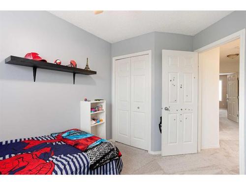 109 Prairie Sound Circle Nw, High River, AB - Indoor Photo Showing Bedroom