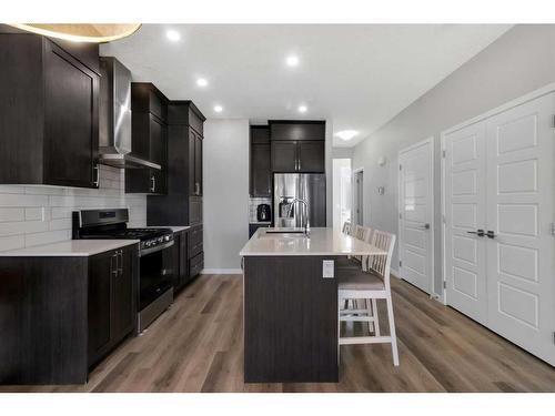 101 Dawson Drive, Chestermere, AB - Indoor Photo Showing Kitchen With Upgraded Kitchen