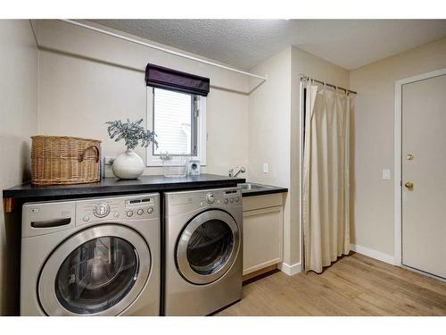 27 Woodford Court Sw, Calgary, AB - Indoor Photo Showing Laundry Room