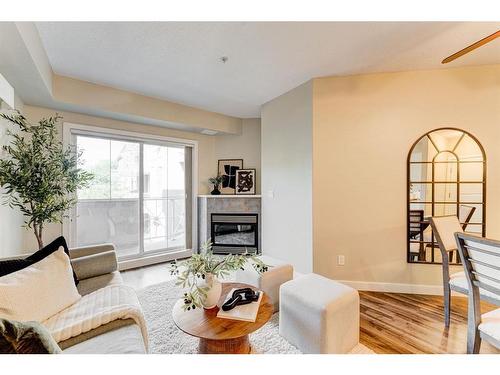 309-1800 14A Street Sw, Calgary, AB - Indoor Photo Showing Living Room With Fireplace