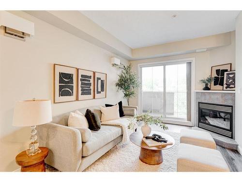 309-1800 14A Street Sw, Calgary, AB - Indoor Photo Showing Living Room With Fireplace