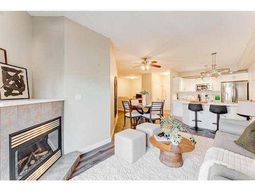 309-1800 14A Street Sw, Calgary, AB - Indoor Photo Showing Living Room With Fireplace