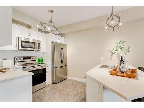 309-1800 14A Street Sw, Calgary, AB - Indoor Photo Showing Kitchen With Stainless Steel Kitchen With Double Sink