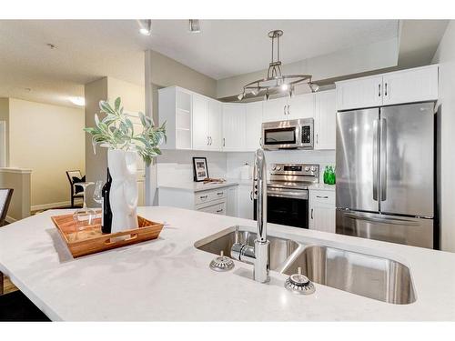 309-1800 14A Street Sw, Calgary, AB - Indoor Photo Showing Kitchen With Stainless Steel Kitchen