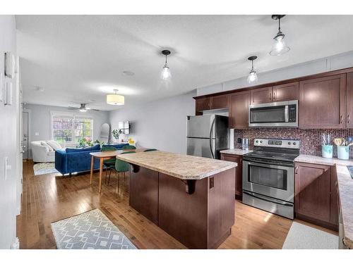 213 Rainbow Falls Manor, Chestermere, AB - Indoor Photo Showing Kitchen With Stainless Steel Kitchen