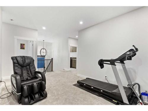 198 Kinniburgh Crescent, Chestermere, AB - Indoor Photo Showing Gym Room