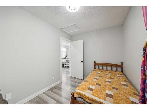 13 Erin Grove Place Se, Calgary, AB - Indoor Photo Showing Bedroom
