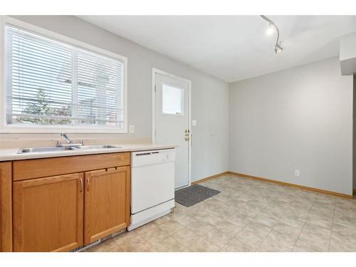 543 Regal Park Ne, Calgary, AB - Indoor Photo Showing Kitchen With Double Sink