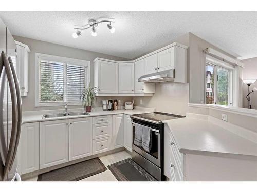 2118-16320 24 Street Sw, Calgary, AB - Indoor Photo Showing Kitchen With Double Sink