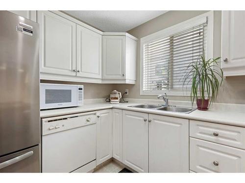 2118-16320 24 Street Sw, Calgary, AB - Indoor Photo Showing Kitchen With Double Sink