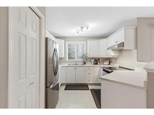 2118-16320 24 Street Sw, Calgary, AB - Indoor Photo Showing Kitchen With Double Sink