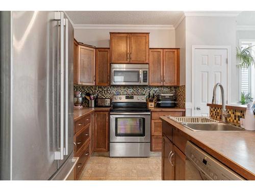 122 Evanscove Circle Nw, Calgary, AB - Indoor Photo Showing Kitchen With Stainless Steel Kitchen With Double Sink