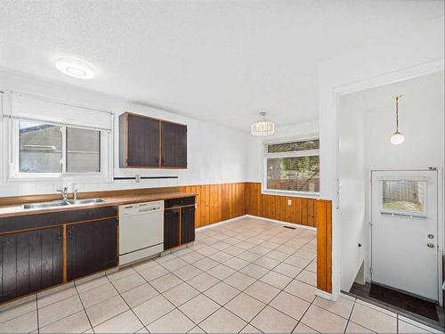 207 Fallswater Road Ne, Calgary, AB - Indoor Photo Showing Kitchen With Double Sink