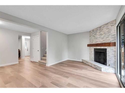 3-310 Brookmere Road Sw, Calgary, AB - Indoor With Fireplace