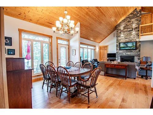 32 St George Way, Rochon Sands, AB - Indoor Photo Showing Dining Room With Fireplace