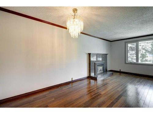 455 Queen Charlotte Drive Se, Calgary, AB - Indoor With Fireplace