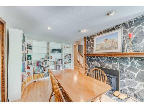 178125 240 Street West, Rural Foothills County, AB - Indoor Photo Showing Dining Room With Fireplace