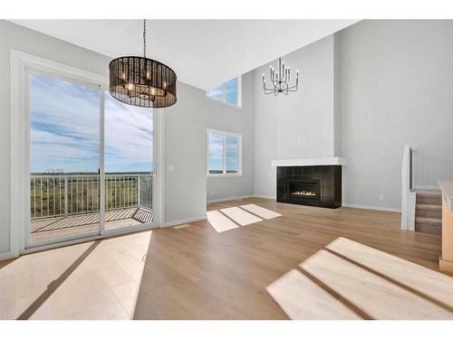 42 Savoy Landing Se, Calgary, AB - Indoor Photo Showing Living Room With Fireplace