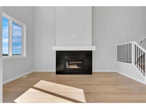 42 Savoy Landing Se, Calgary, AB - Indoor Photo Showing Living Room With Fireplace