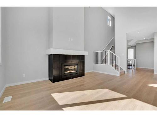 42 Savoy Landing Se, Calgary, AB - Indoor Photo Showing Living Room With Fireplace