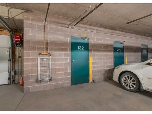 132-7229 Sierra Morena Boulevard Sw, Calgary, AB - Indoor Photo Showing Garage