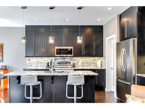 45 Westmore Place Sw, Calgary, AB - Indoor Photo Showing Kitchen With Upgraded Kitchen