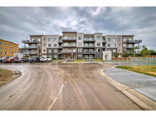 112-150 Shawnee Square Sw, Calgary, AB - Outdoor With Facade