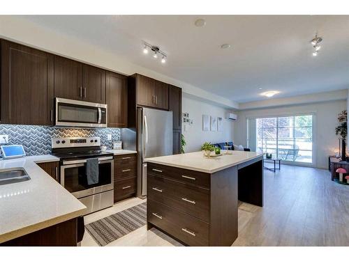 7102-151 Legacy Main Street Se, Calgary, AB - Indoor Photo Showing Kitchen With Stainless Steel Kitchen With Double Sink With Upgraded Kitchen