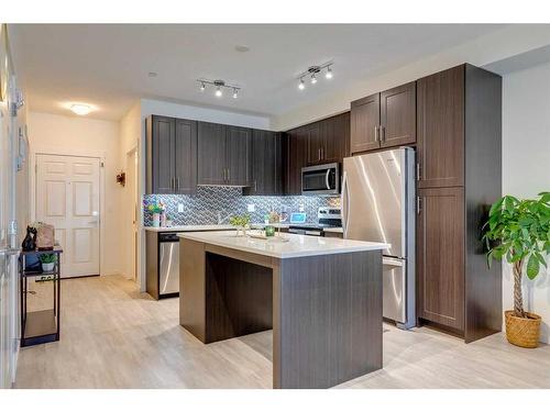 7102-151 Legacy Main Street Se, Calgary, AB - Indoor Photo Showing Kitchen With Stainless Steel Kitchen With Upgraded Kitchen