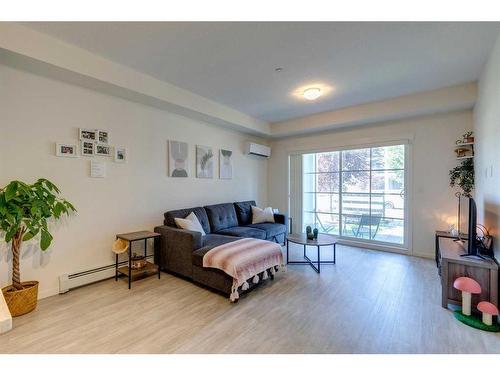 7102-151 Legacy Main Street Se, Calgary, AB - Indoor Photo Showing Living Room