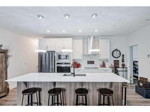 112-500 Auburn Meadows Common Se, Calgary, AB - Indoor Photo Showing Kitchen With Stainless Steel Kitchen With Upgraded Kitchen