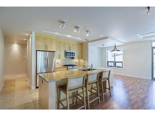 304-701 3 Avenue Sw, Calgary, AB - Indoor Photo Showing Kitchen With Stainless Steel Kitchen