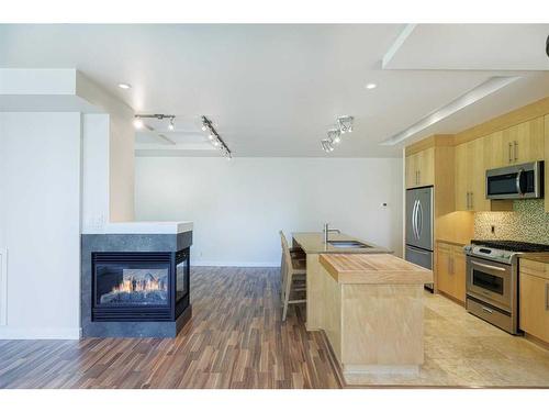 304-701 3 Avenue Sw, Calgary, AB - Indoor Photo Showing Kitchen With Stainless Steel Kitchen