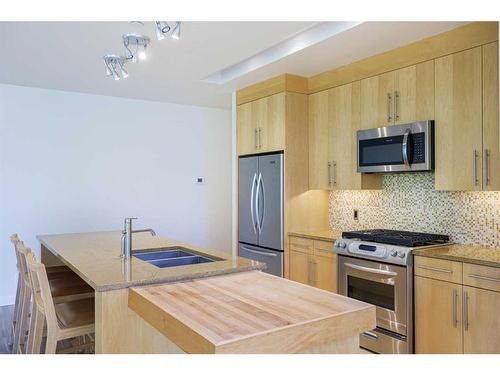 304-701 3 Avenue Sw, Calgary, AB - Indoor Photo Showing Kitchen With Stainless Steel Kitchen