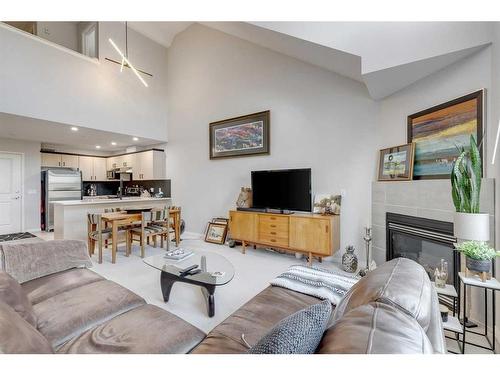 308-3651 Marda Link Sw, Calgary, AB - Indoor Photo Showing Living Room With Fireplace